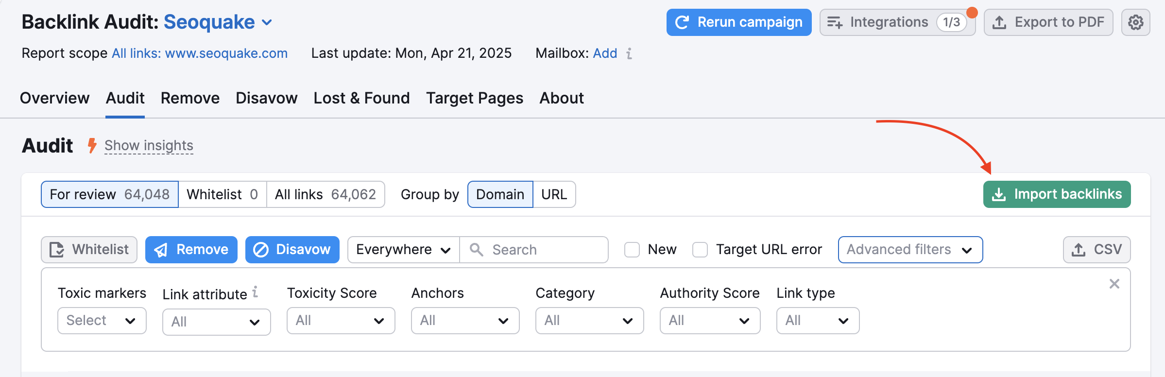 Audit tab in Backlink Audit. A red arrow is pointing to the green 'Import backlinks' button on the right side of the screen.